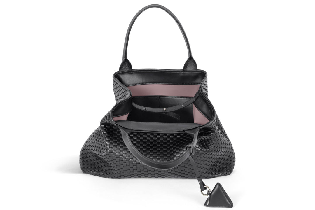 Alt tag: Elegant black woven handbag with handles and keychain accessory