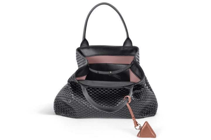 Elegant black leather woven handbag with brown accent, stylish accessory for women.