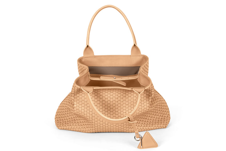 Woven beige leather tote bag with dual handles and keychain accessory.