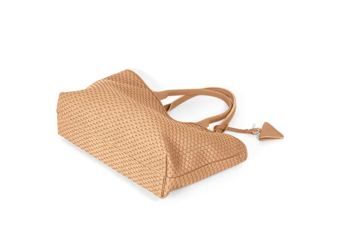 Woven beige leather tote bag with dual handles and keychain accessory.