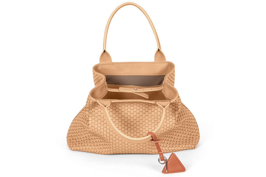 Tan woven leather handbag with handles and a triangular accent.