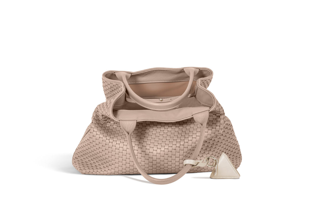 Elegant beige woven leather tote bag with handles and a decorative tag.