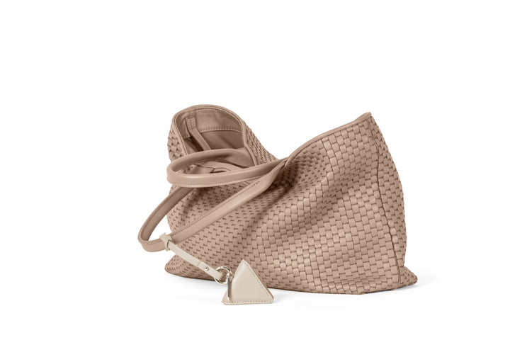 Elegant beige woven leather tote bag with handles and a decorative tag.