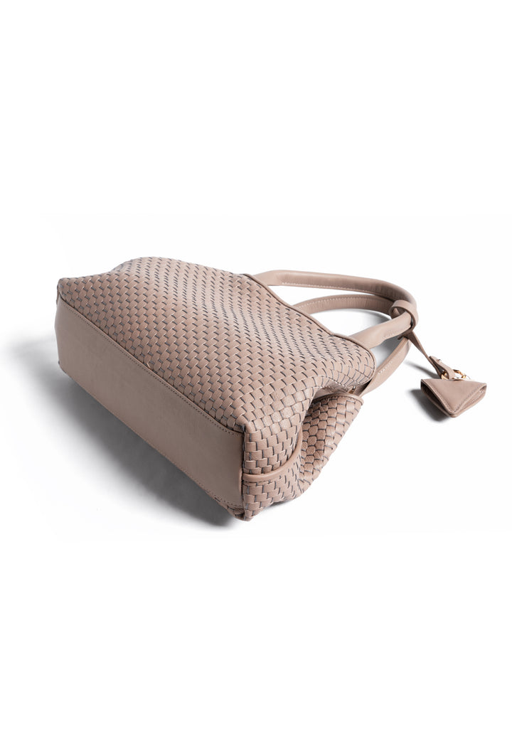 Alt text: Elegant woven leather handbag in taupe with a triangular pendant on a white background