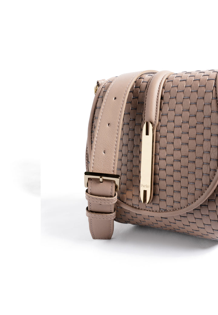 Taupe woven crossbody handbag with adjustable strap and gold hardware on white background.