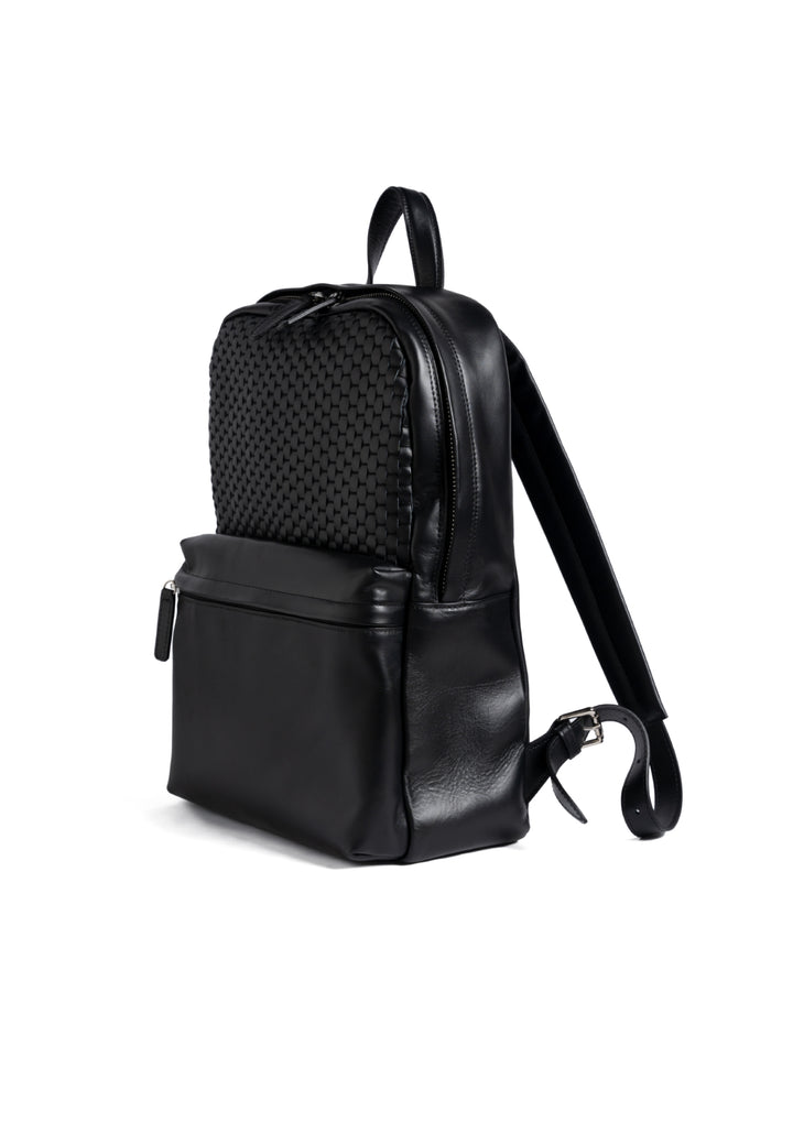 Elegant black leather backpack with woven detailing and front zipper pocket.