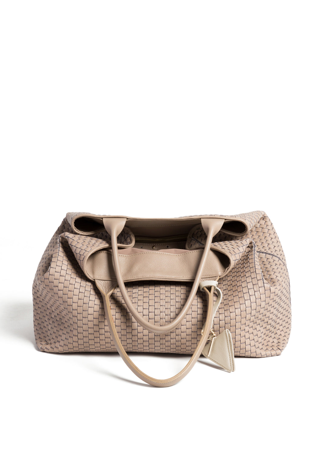 Elegant beige woven handbag with triangular charm and dual handles.