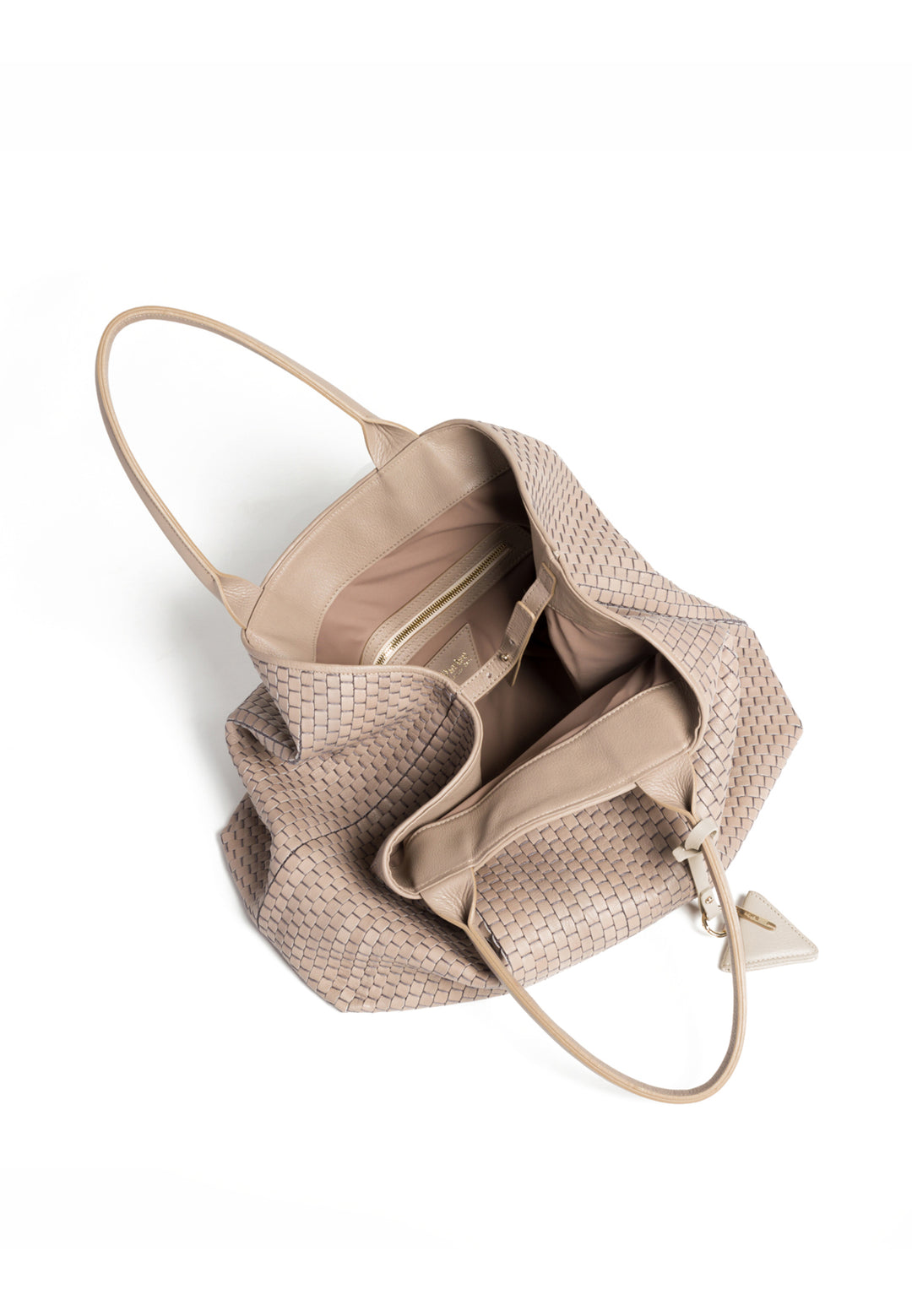 Elegant beige woven handbag with triangular charm and dual handles.