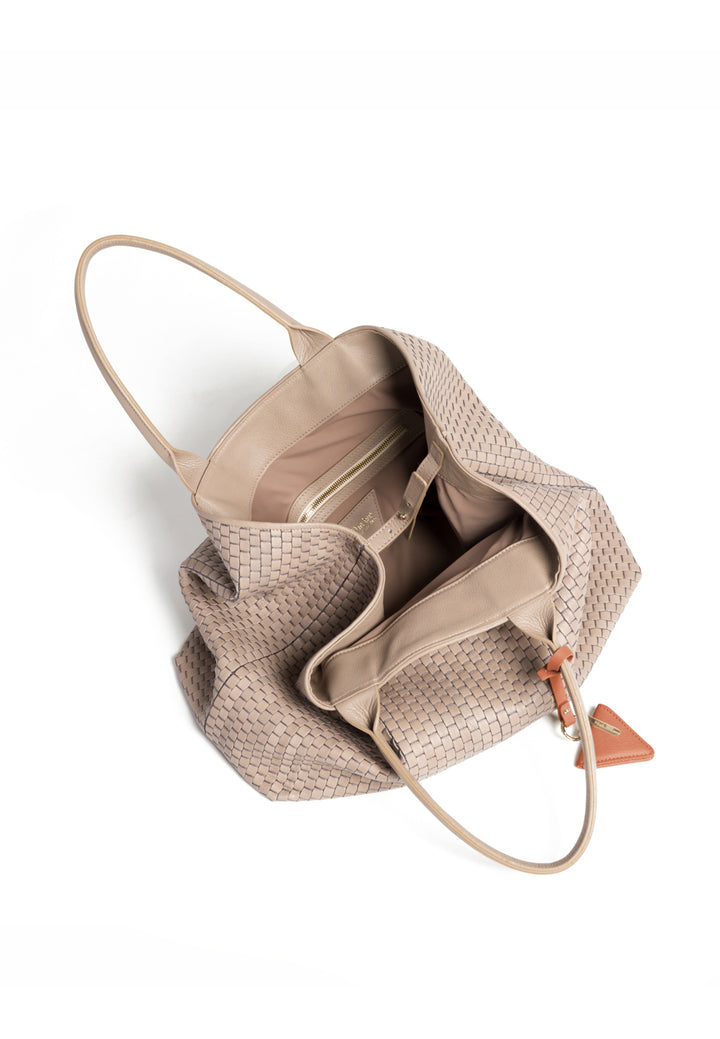 Woven beige leather tote bag with handles and a triangular leather charm.