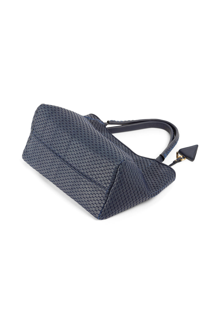 Elegant woven leather handbag in navy blue with a black triangle charm.