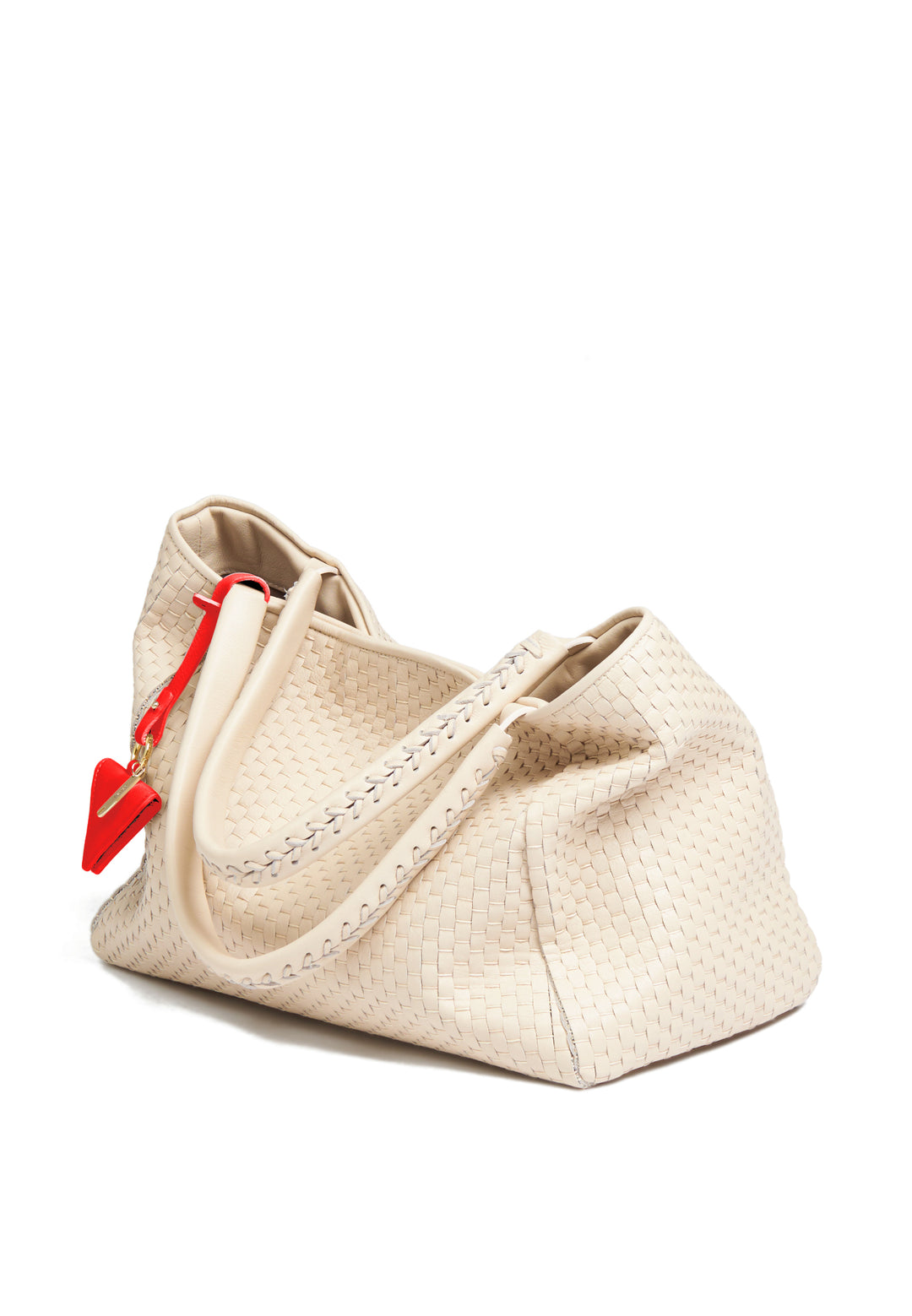 White woven handbag with red geometric accent tag.