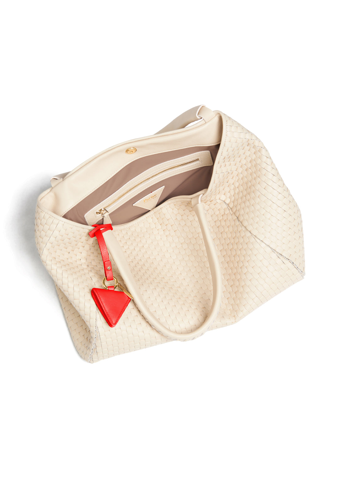 White woven handbag with red geometric accent tag.