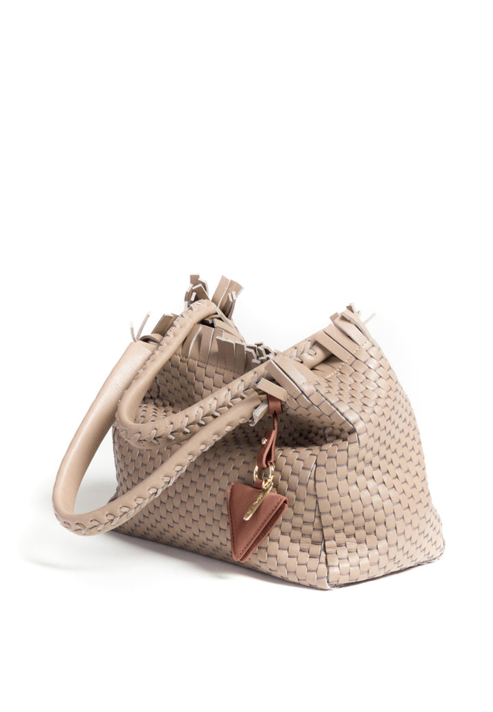 Woven beige handbag with top handles and decorative leather tag.