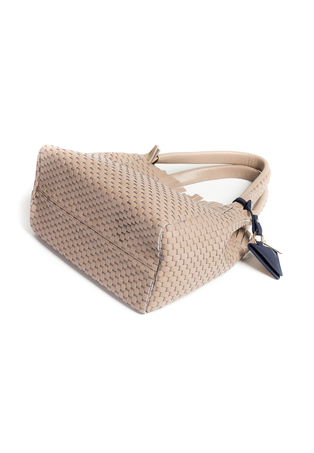 Elegant beige woven handbag with braided handles and a small navy blue accessory.