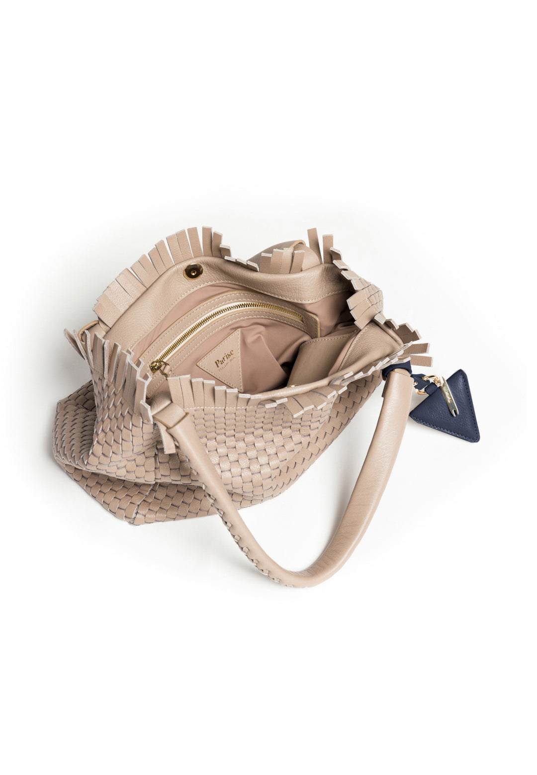 Elegant beige woven handbag with braided handles and a small navy blue accessory.