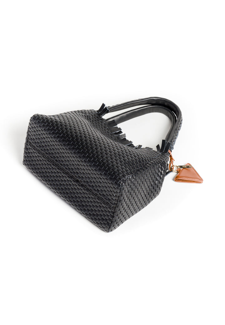 Black woven leather handbag with brown leather accent and triangular buckle on white background.