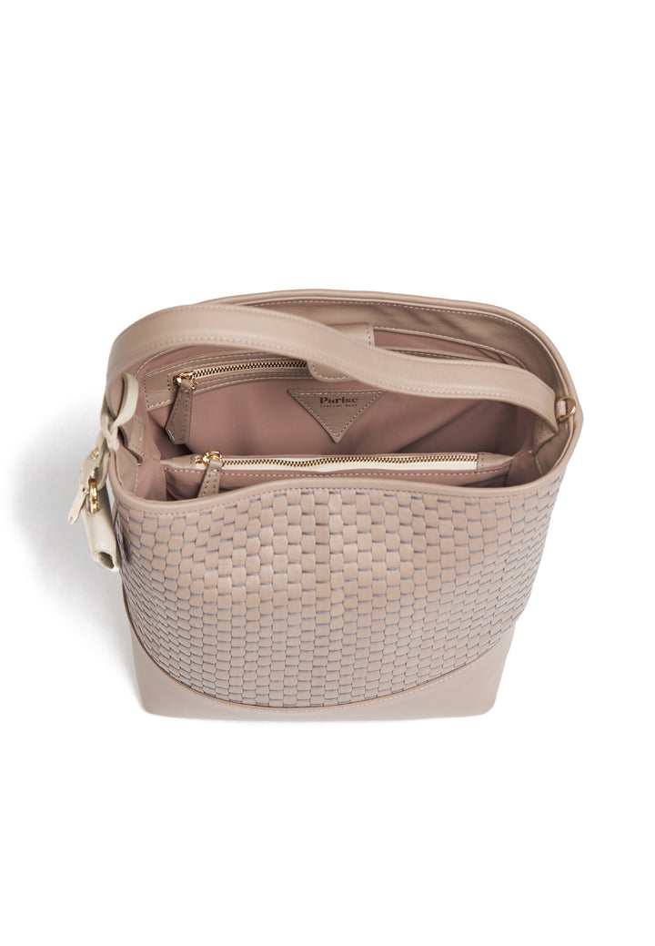 Beige woven leather handbag with long adjustable strap.