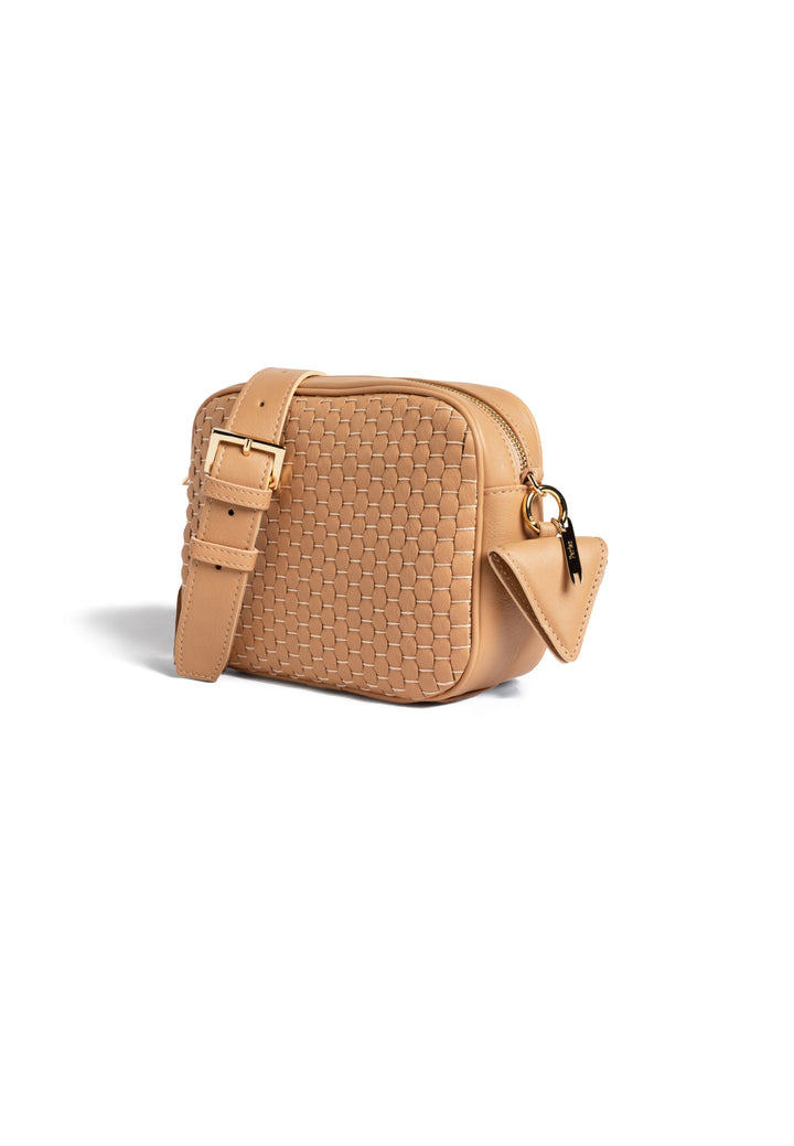 Tan woven crossbody bag with adjustable strap.