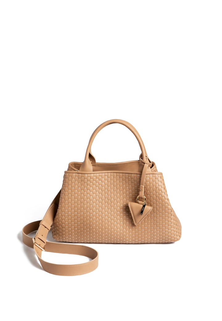 Tan woven leather handbag with dual handles and a triangular charm.