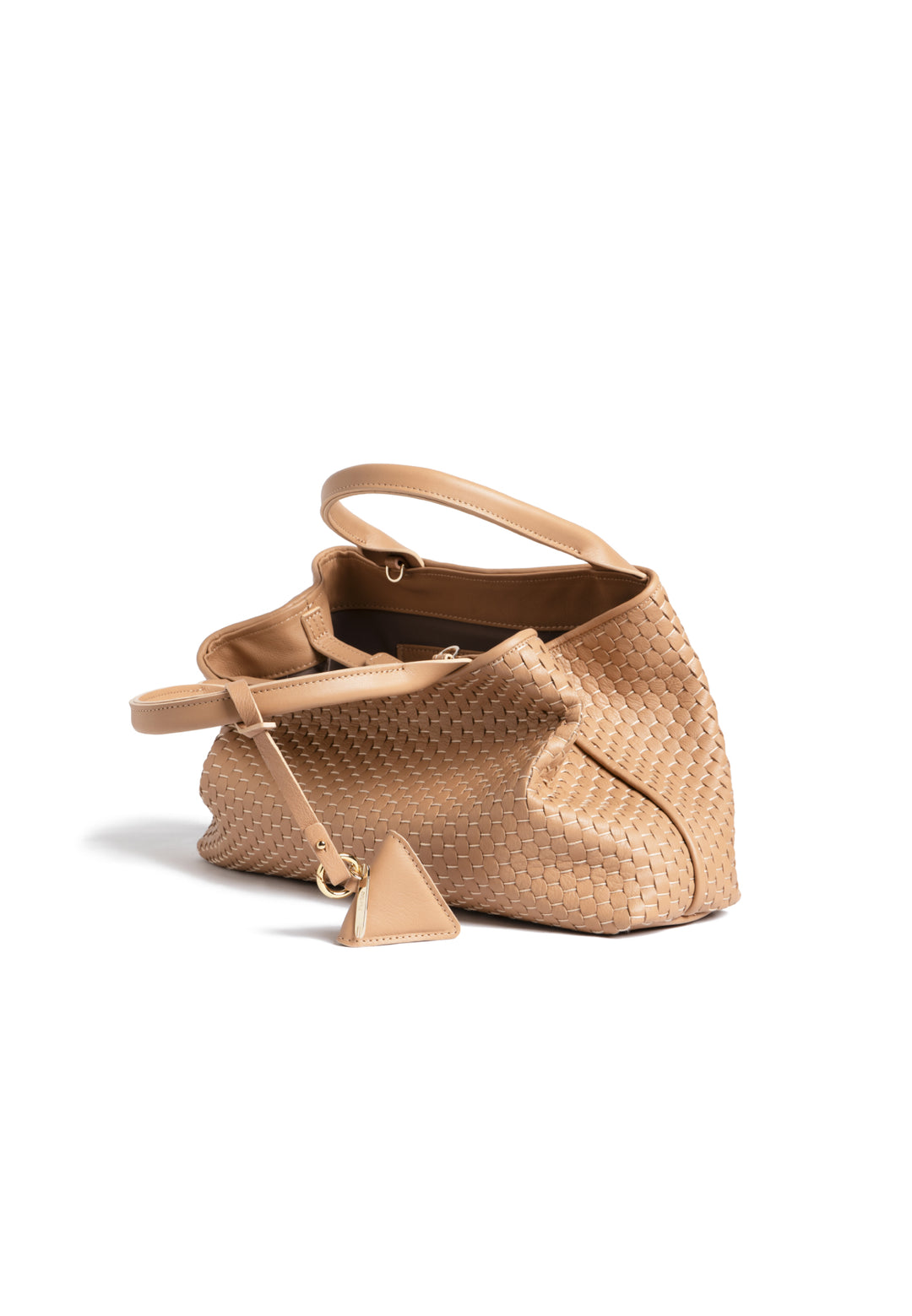 Tan woven leather handbag with dual handles and a triangular charm.