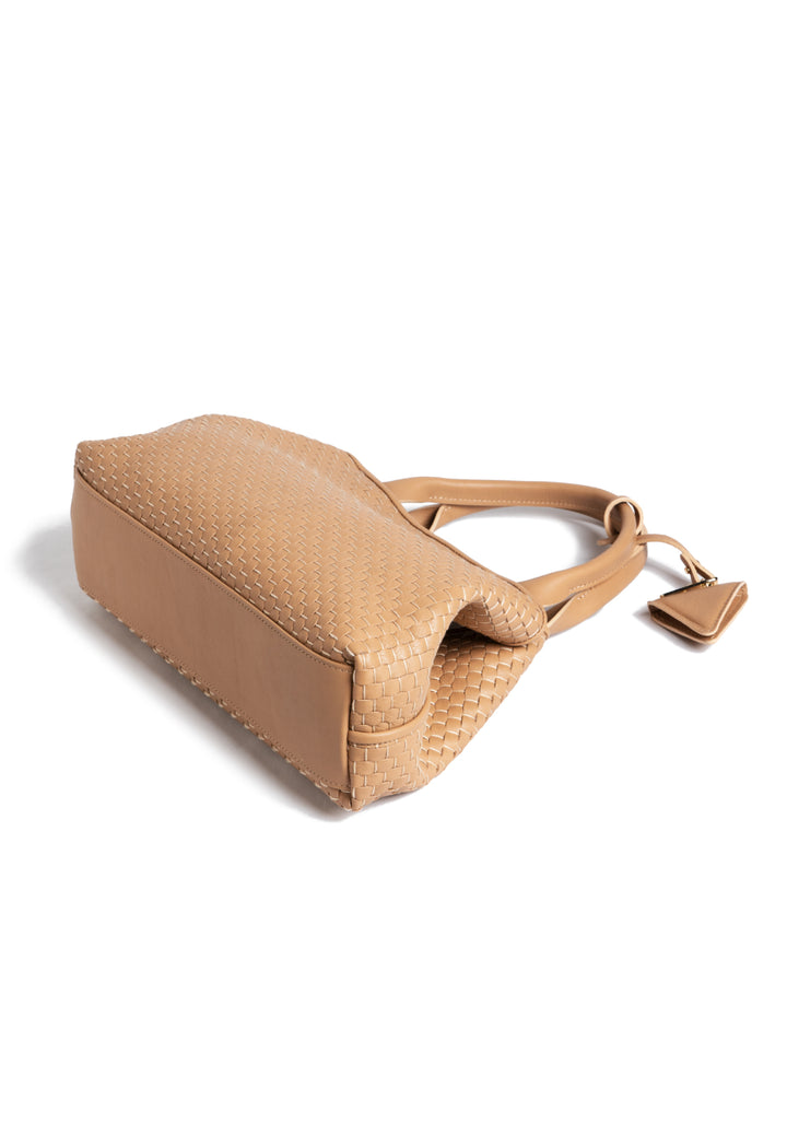 Tan woven leather handbag with dual handles and a triangular charm.