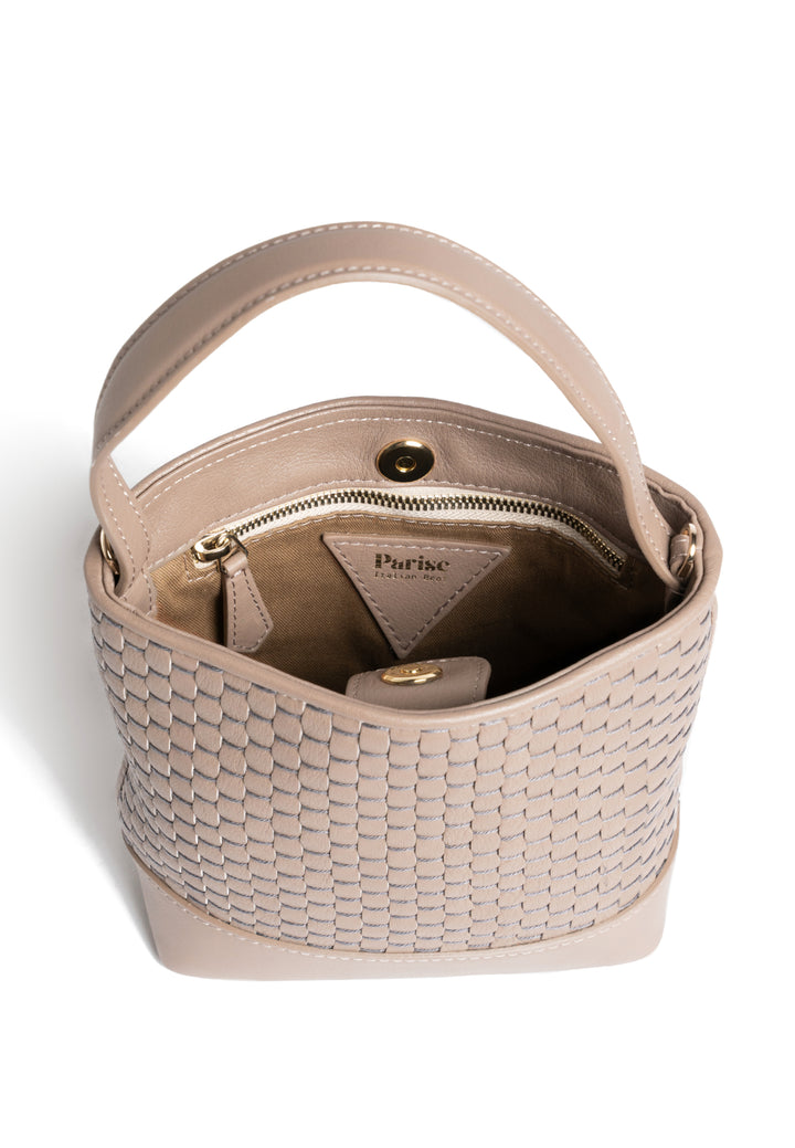 Elegant beige woven leather handbag with adjustable strap on white background.