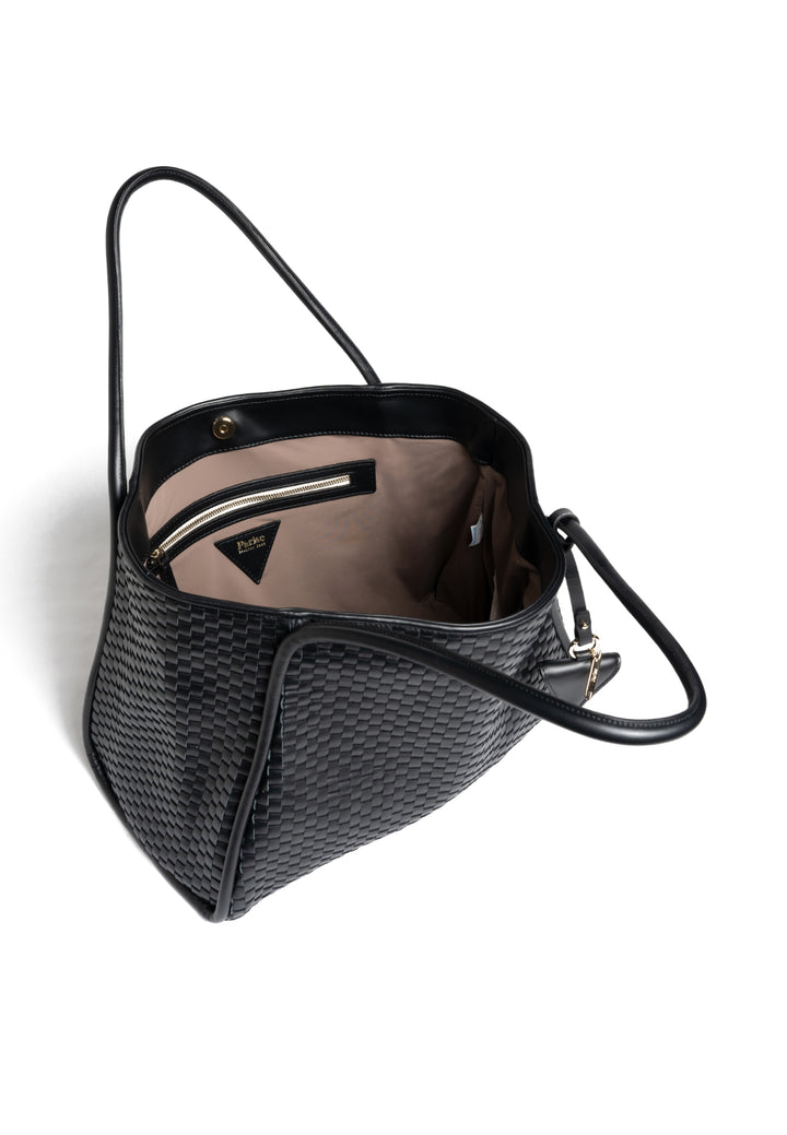 Black woven leather tote bag with handles, featuring a small attached accessory.