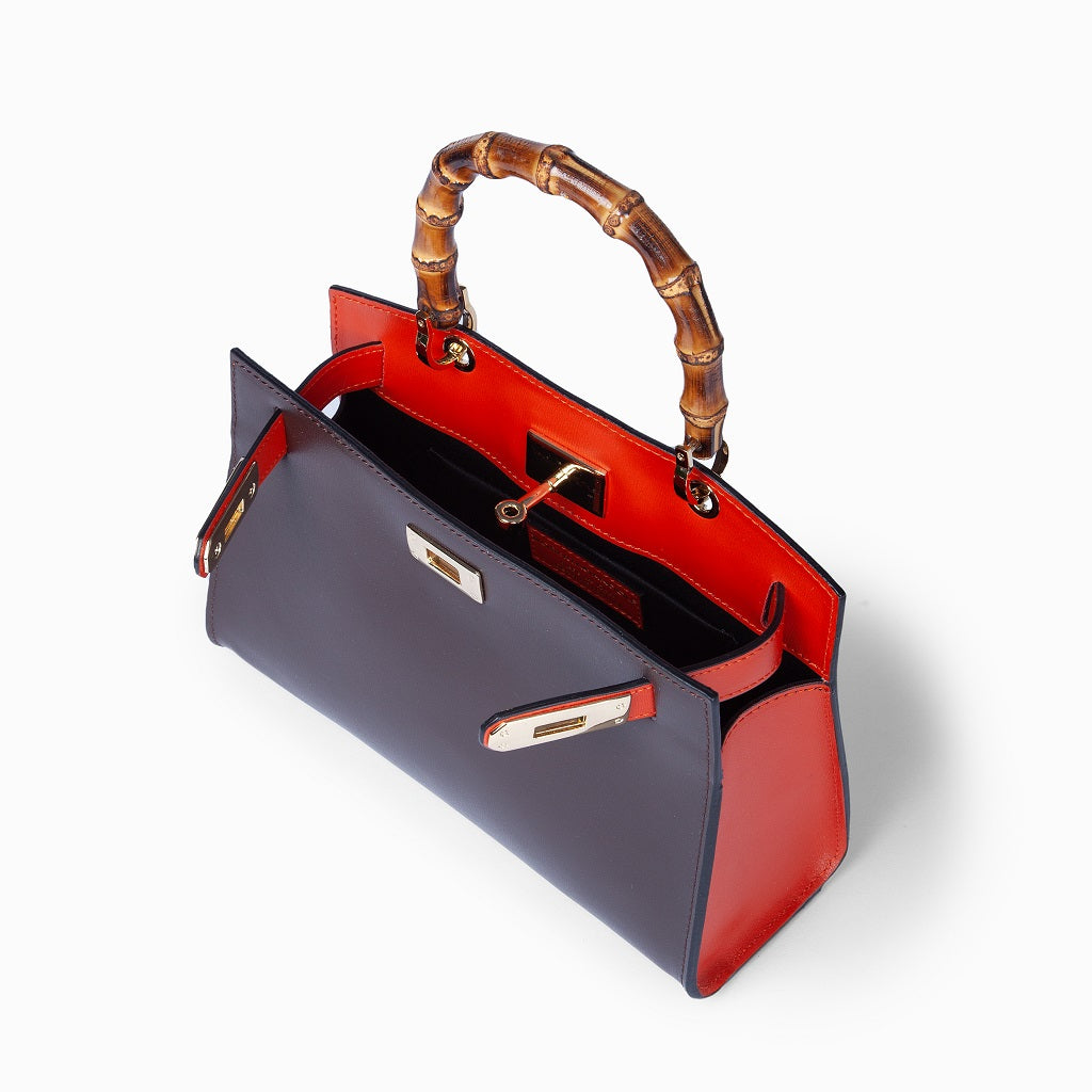 Luxury black and red leather handbag with bamboo handle