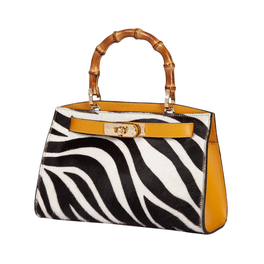 Luxury handbag with zebra print pattern and bamboo handle