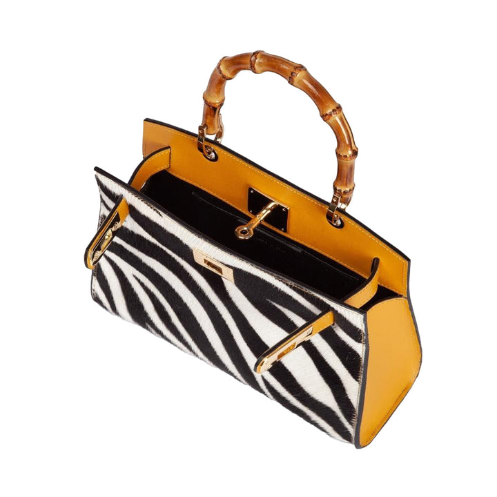 Zebra print handbag with bamboo handle and yellow interior