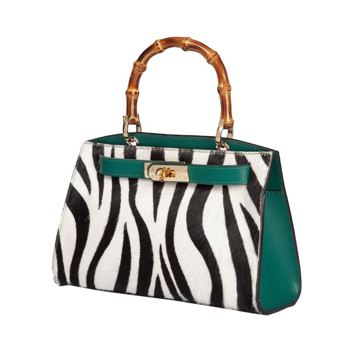 Elegant handbag with zebra print, green accents, and bamboo handle