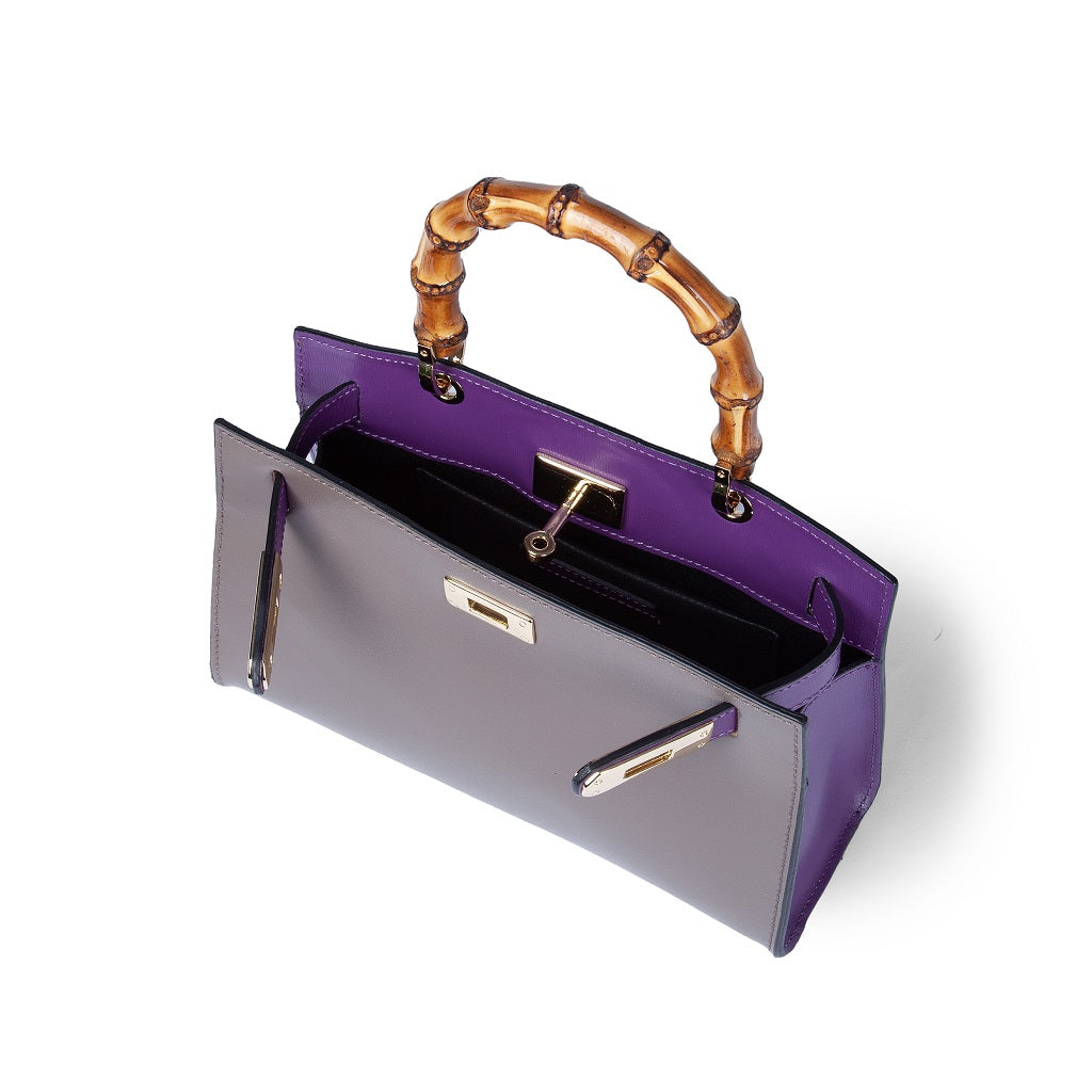 Purple and gray handbag with bamboo handle and gold accents