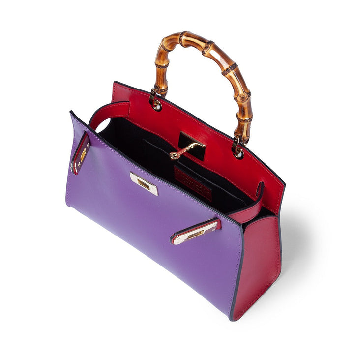 Colorful handbag with bamboo handle and open red and purple compartments