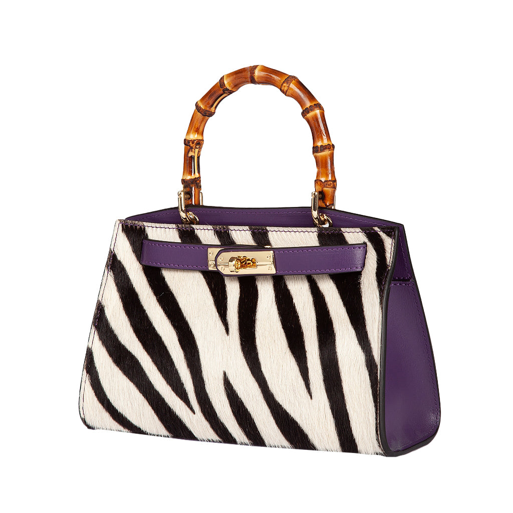 Zebra print handbag with bamboo handle and purple accents