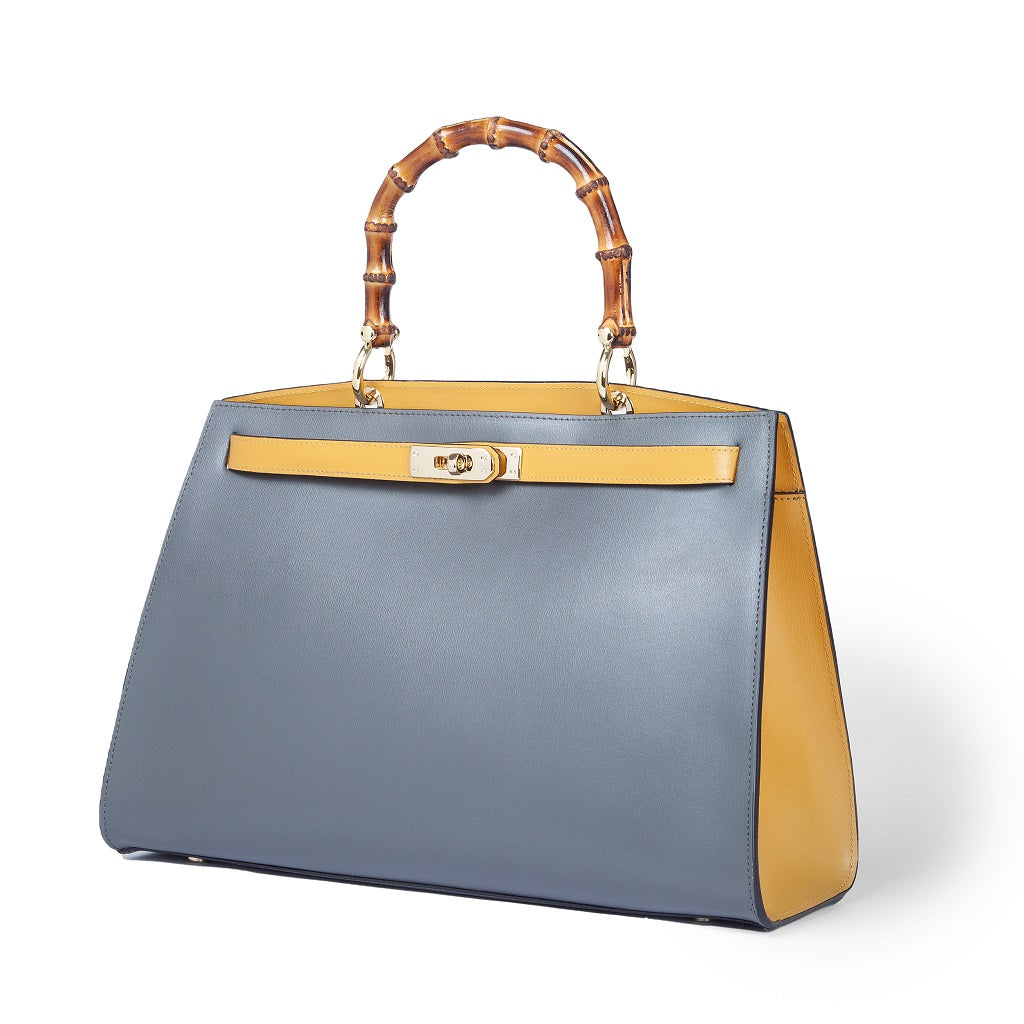 Elegant blue and yellow handbag with bamboo handle