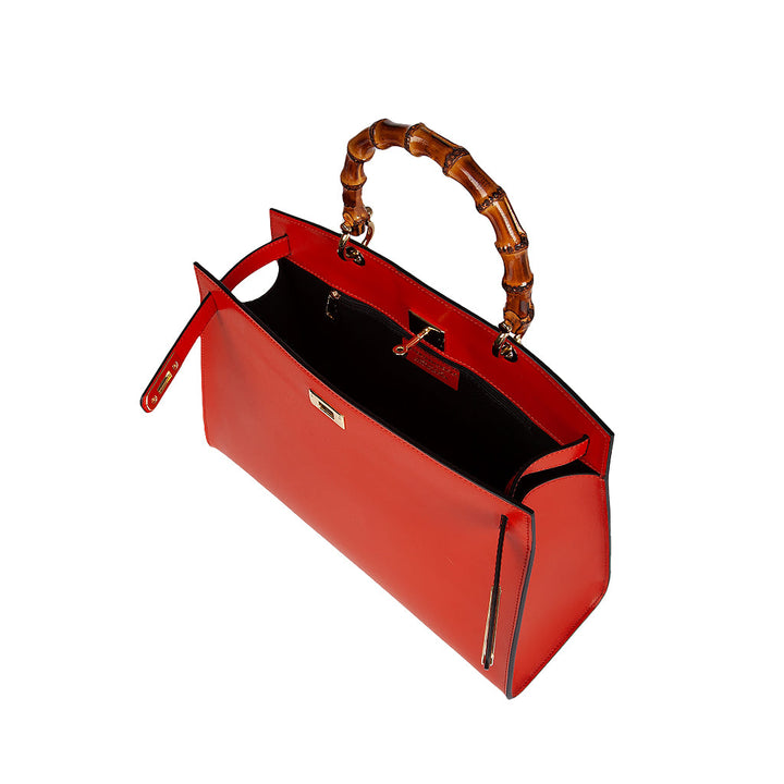 Red leather handbag with bamboo handle and open interior