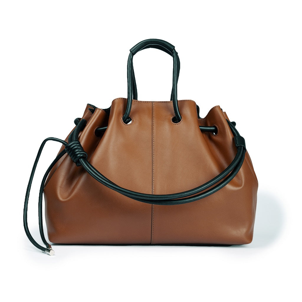 Brown leather handbag with black accents and drawstring closure