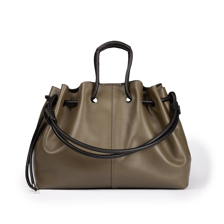 Olive green leather handbag with black handles and drawstring detail