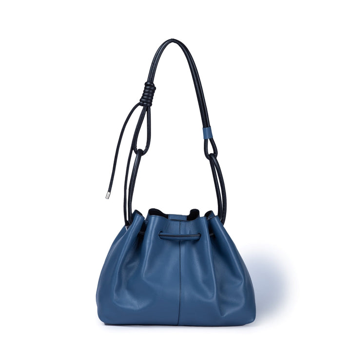 Blue leather bucket bag with adjustable black shoulder strap