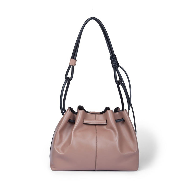 Stylish brown leather handbag with black straps and gathered top design