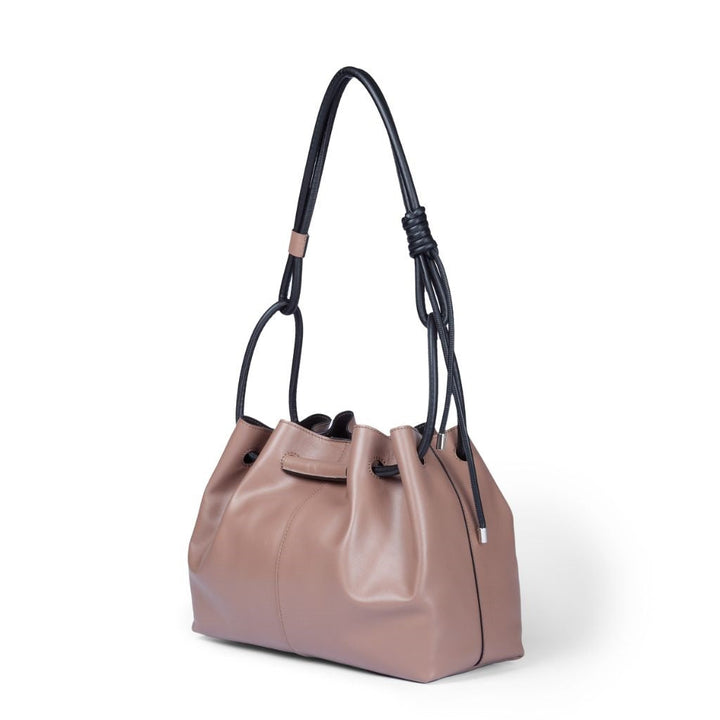 Tan leather bucket bag with adjustable black shoulder strap