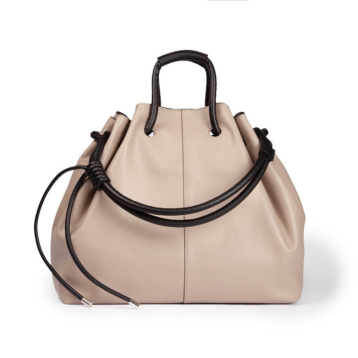 Beige leather handbag with black handles and drawstring closure