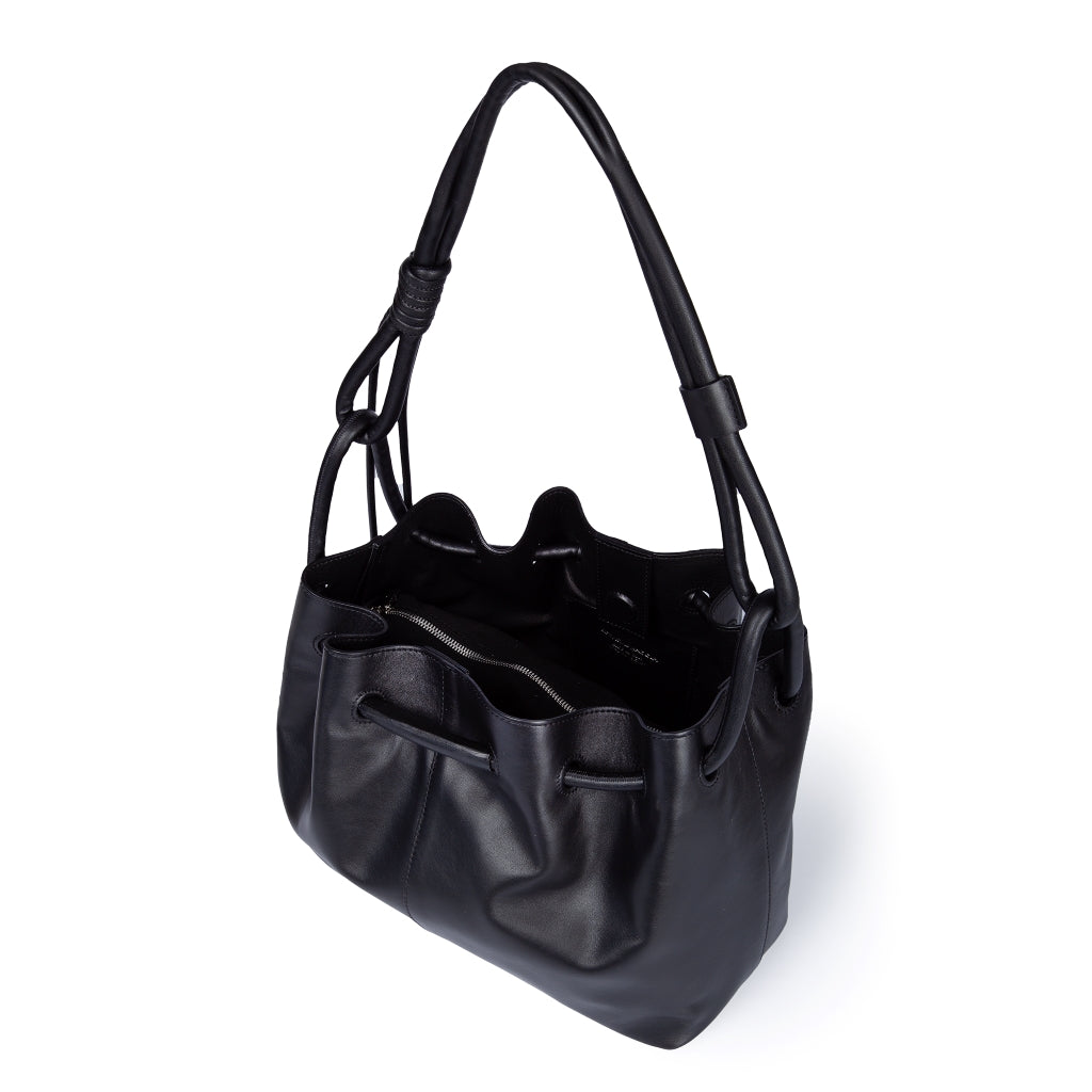 Black leather bucket bag with shoulder strap and drawstring closure