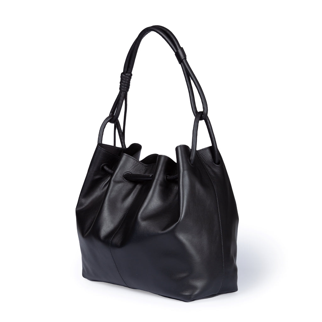 Elegant black leather tote bag with knotted shoulder straps