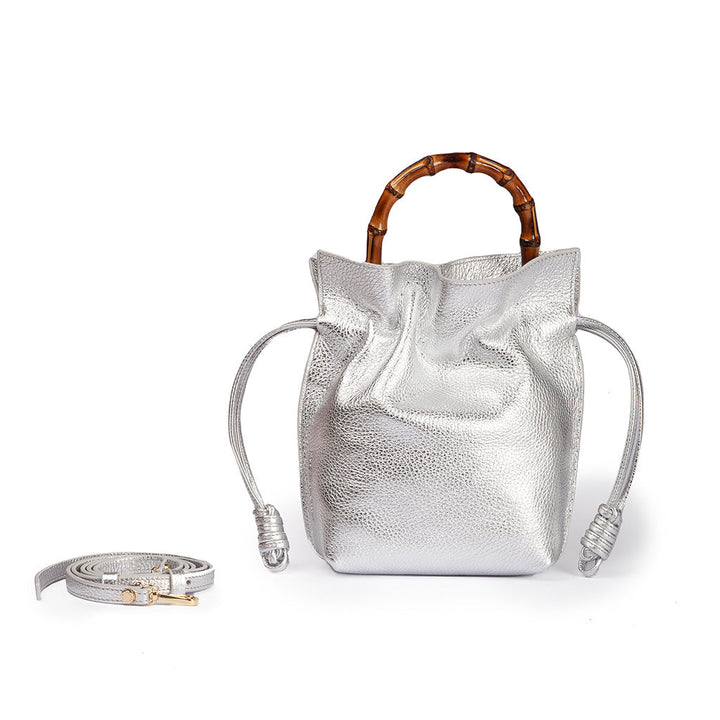 Silver leather handbag with bamboo handle and detachable strap