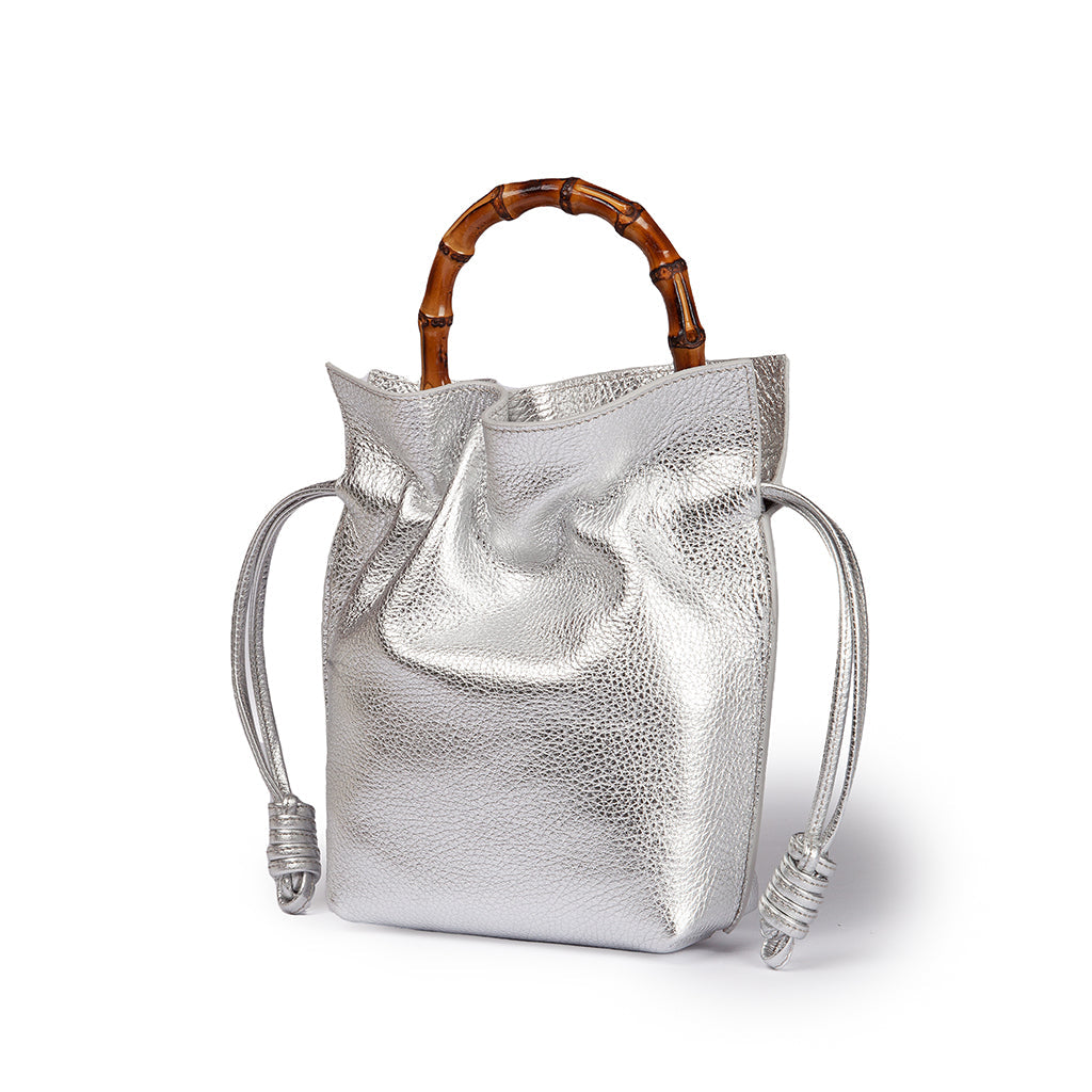 Silver handbag with bamboo handle and drawstring closure