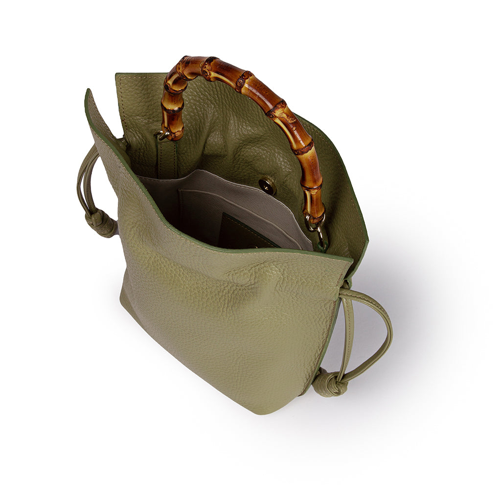 Olive green leather handbag with bamboo handle and open compartment