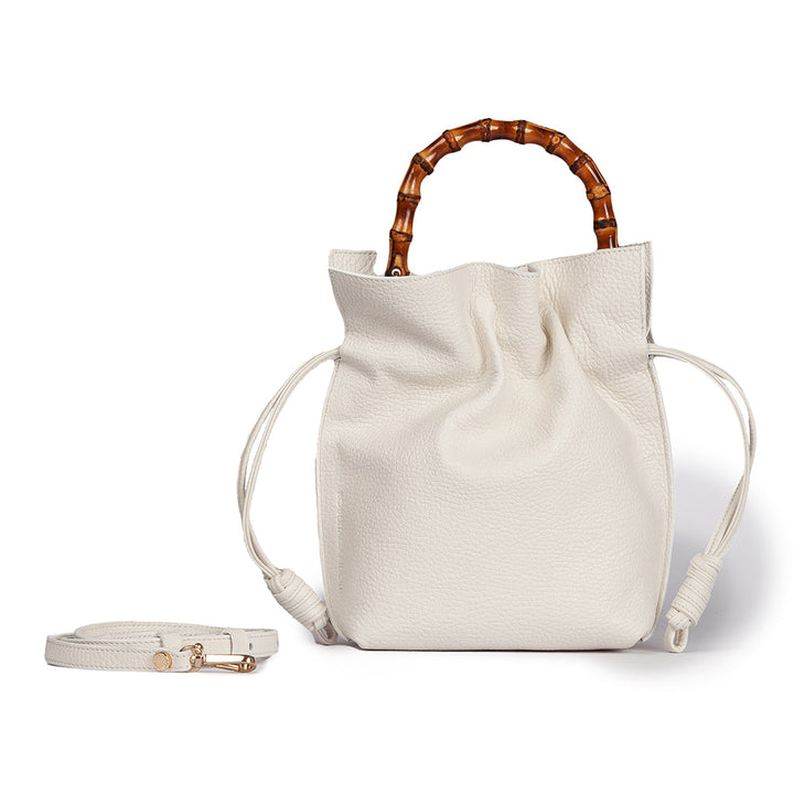 White leather handbag with bamboo handle and detachable strap