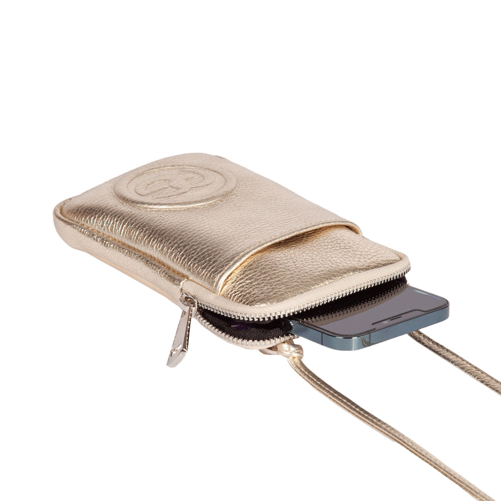 Gold leather pouch with zipper and strap, holding a smartphone