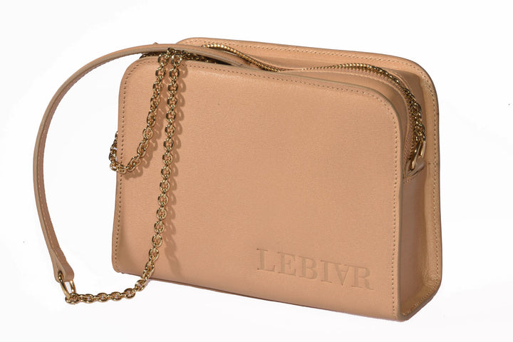 Tan leather handbag with gold chain strap labeled LEBIVR on a white background